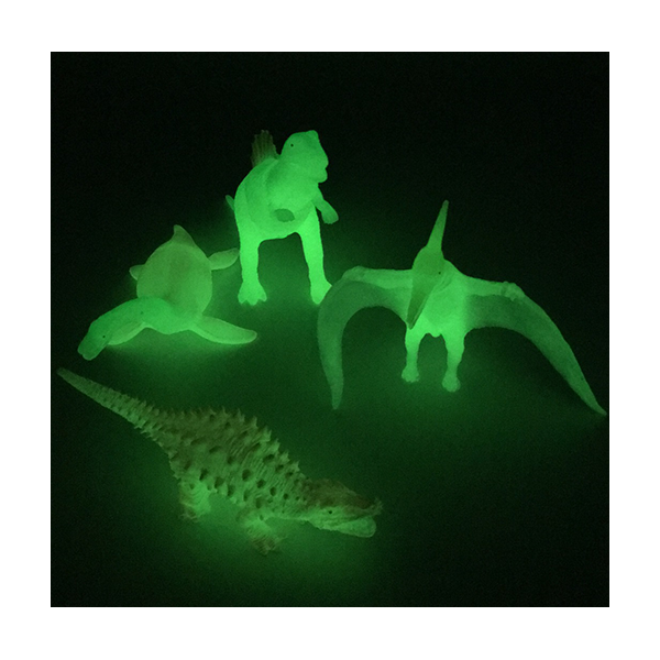 Dinosaurios brillantes en oscuridad
